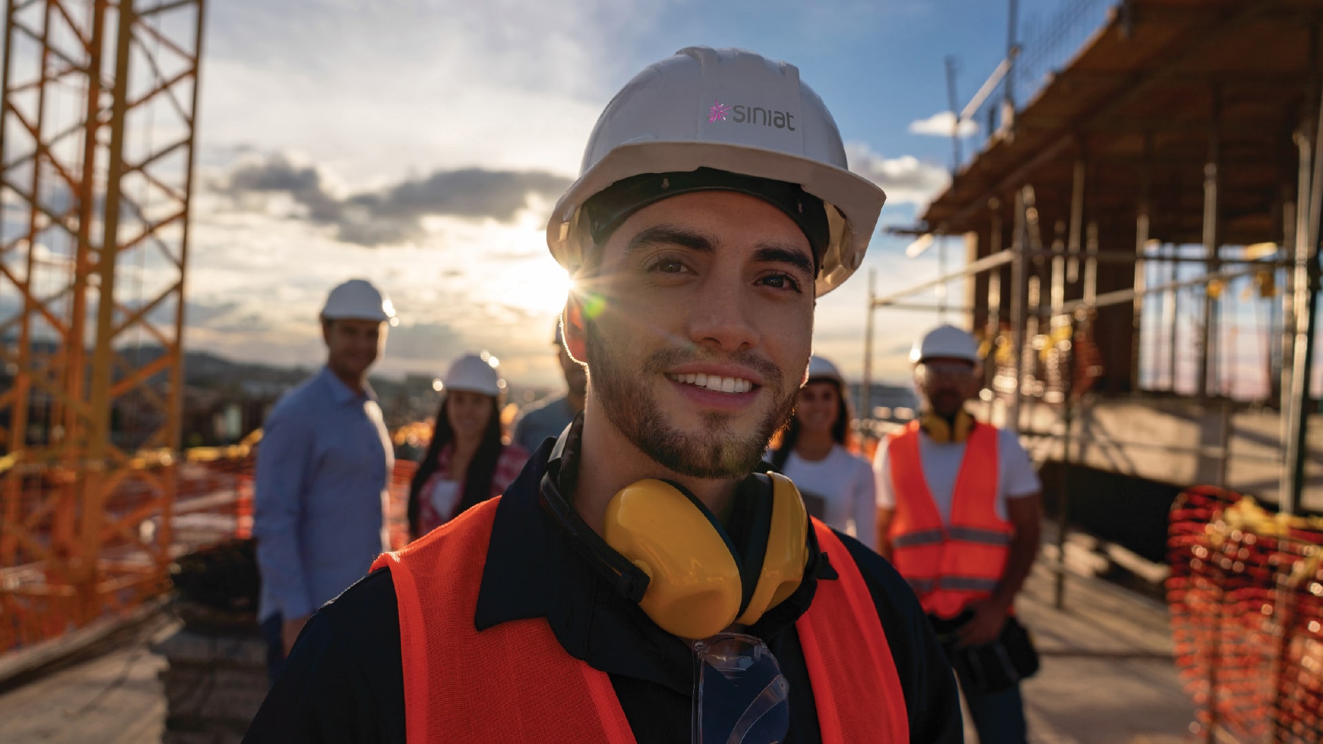 Smiling tradesperson on top of a building