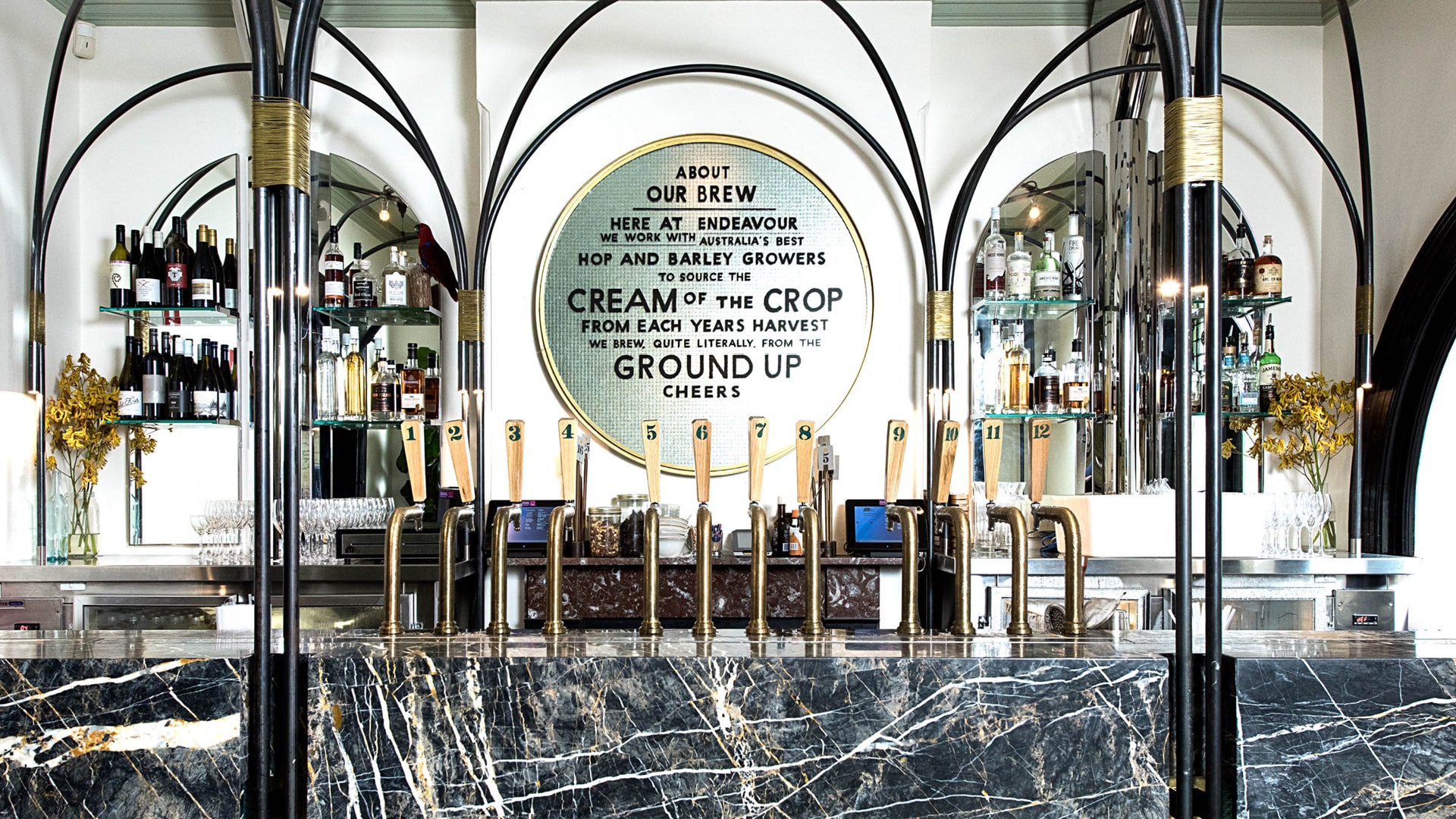 A bar in the rocks with beer taps on marble counter